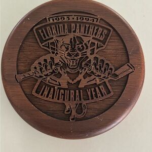 Vintage 1993 Florida Panthers wooden puck from their inaugural year